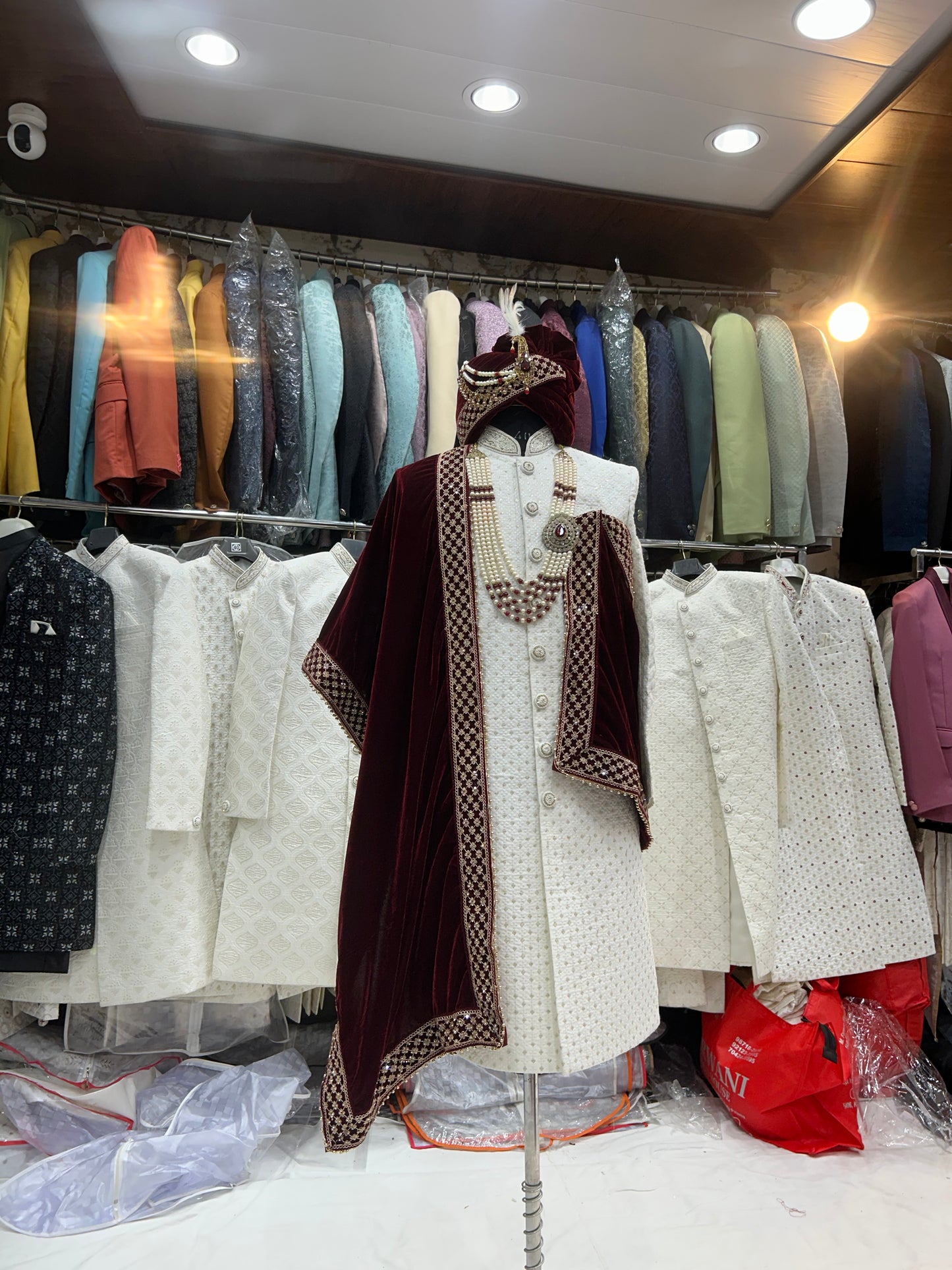 Good looking maroon white sherwani