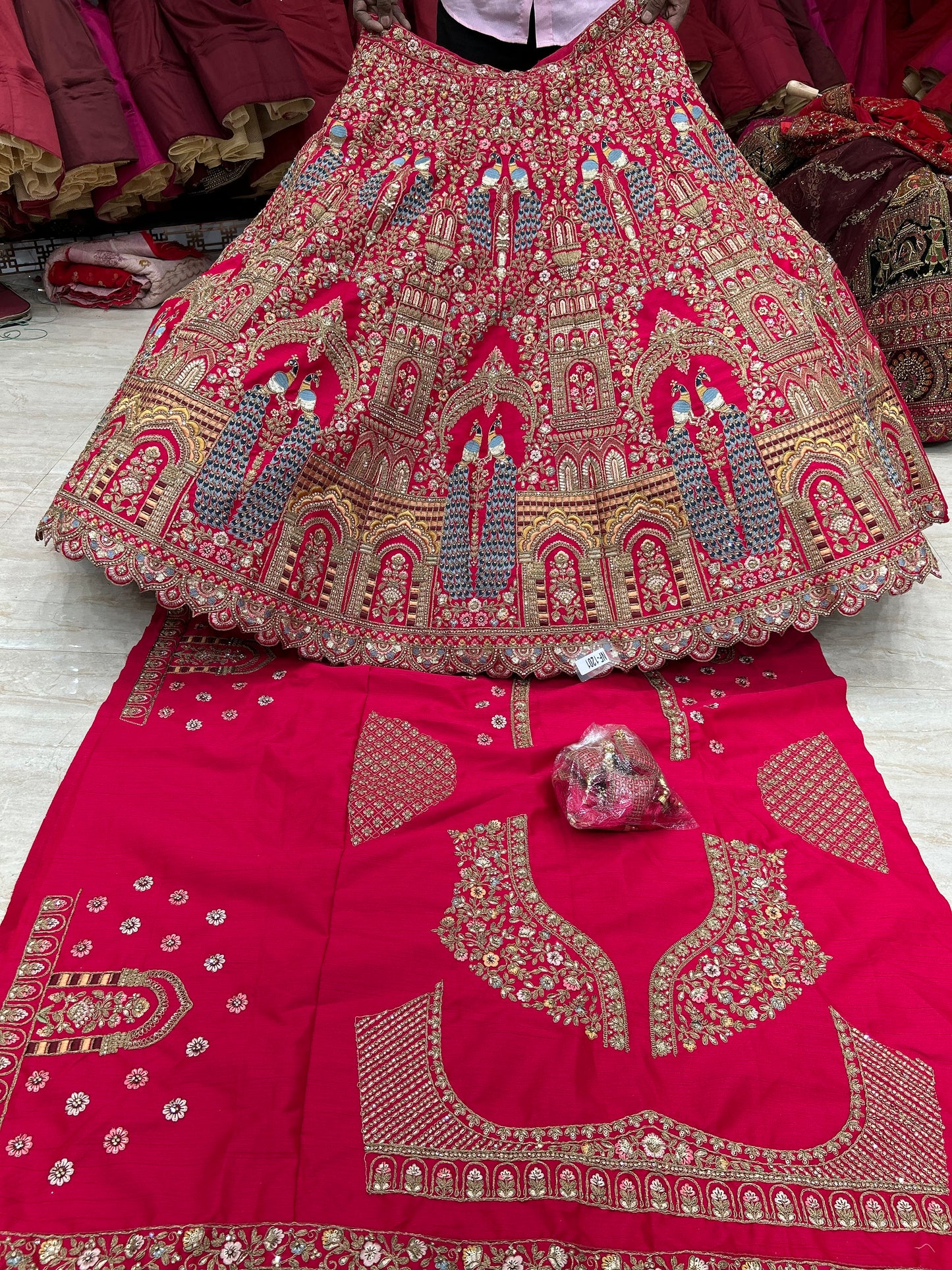 Cute red peacock bridal lehenga