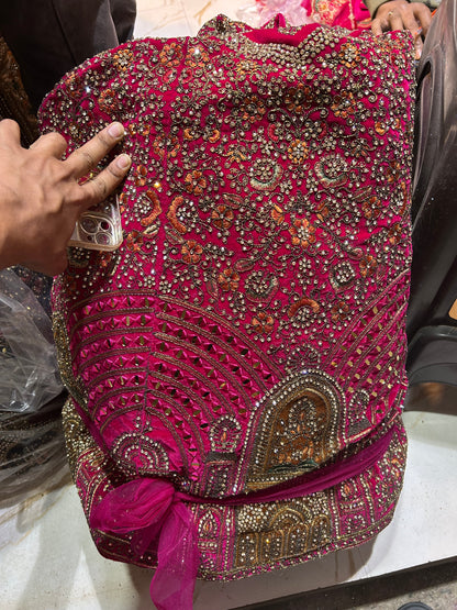 Tremendous pink jhumka bridal lehenga