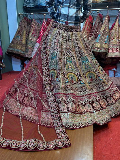 Engaging red peacock gajraj bridal Lehenga