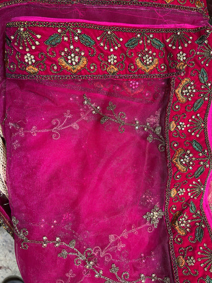 Tremendous pink jhumka bridal lehenga