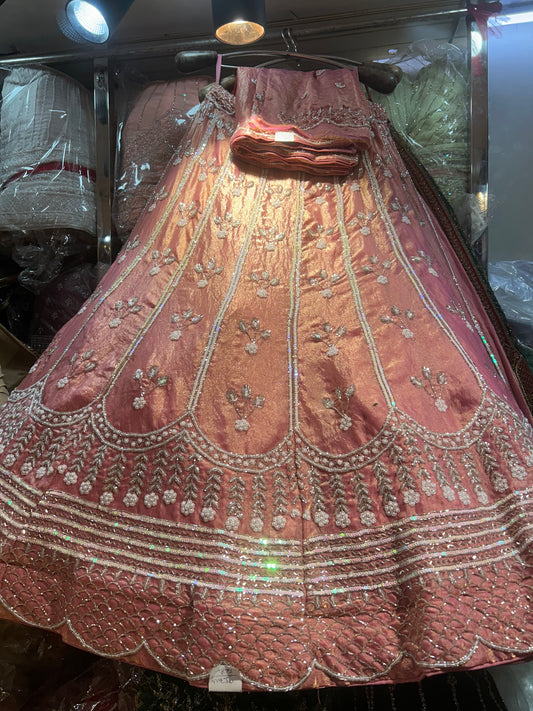 Tremendous peach pink handwork lehenga