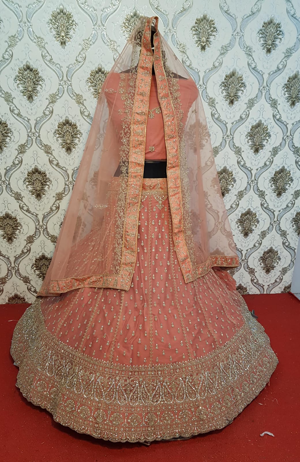 Glamorous orange net fabric Lehenga