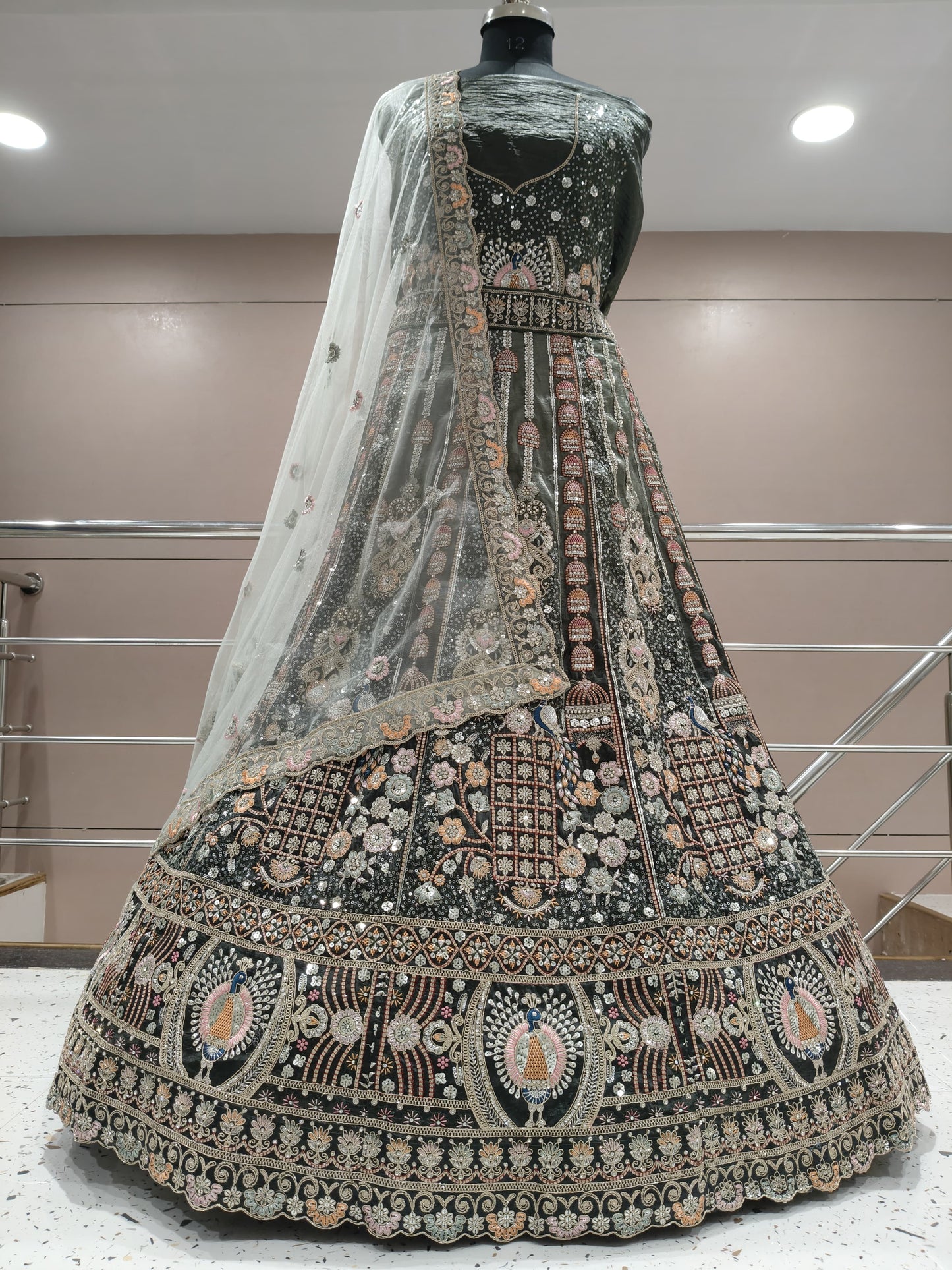 Astonishing dark green peacock lehenga