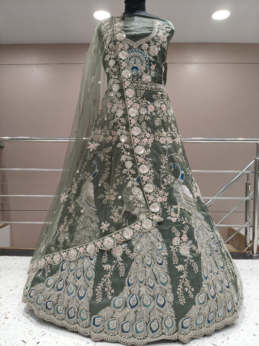 Something different olive green  peacock lehenga