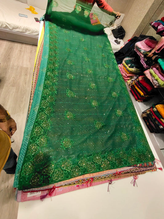 Nice looking bottle green saree